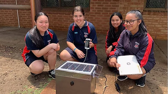 NXplorers students with their solar charging station at their school